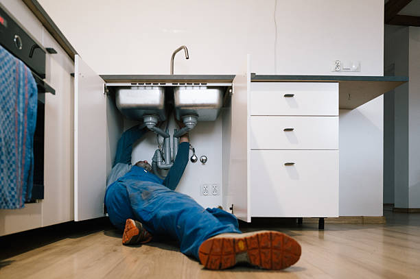 Professional Drain Cleaning technician working in Laramie, WY